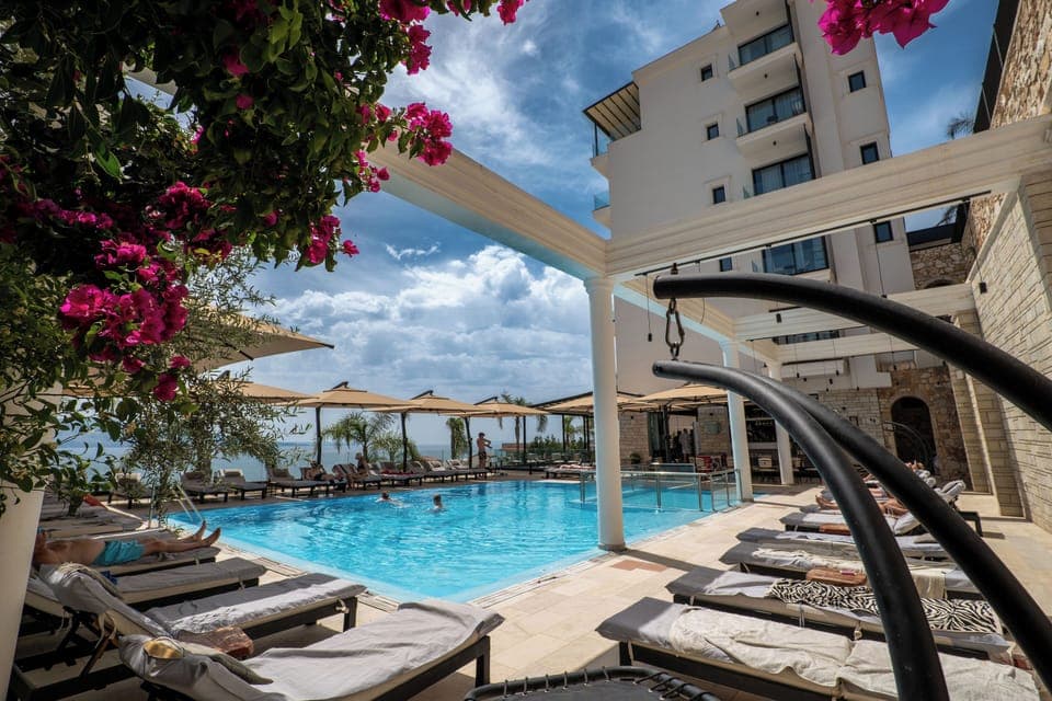 Seasonal outdoor pool, open 8:00 AM to 8:00 PM, pool umbrellas