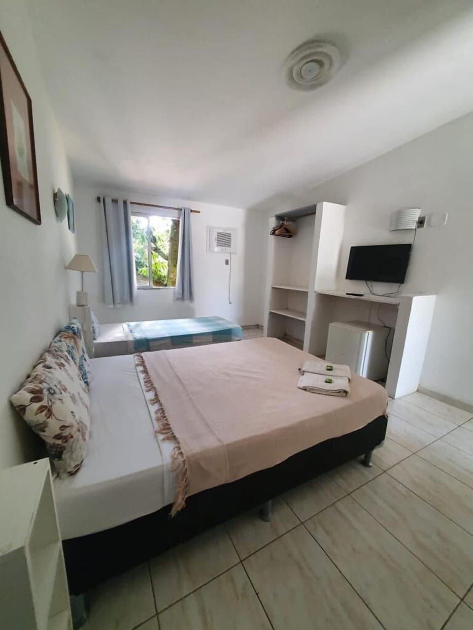 Economy Triple Room | Blackout drapes, rollaway beds, free WiFi, bed sheets