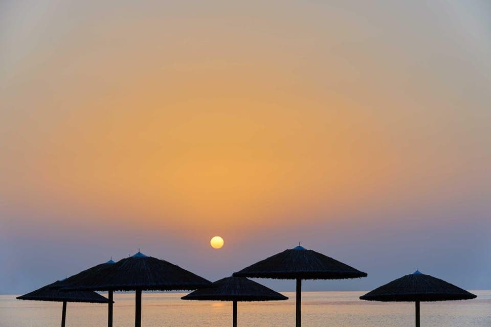Private beach, white sand, sun loungers, beach umbrellas