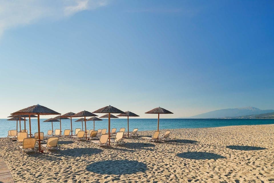 Private beach, white sand, sun loungers, beach umbrellas