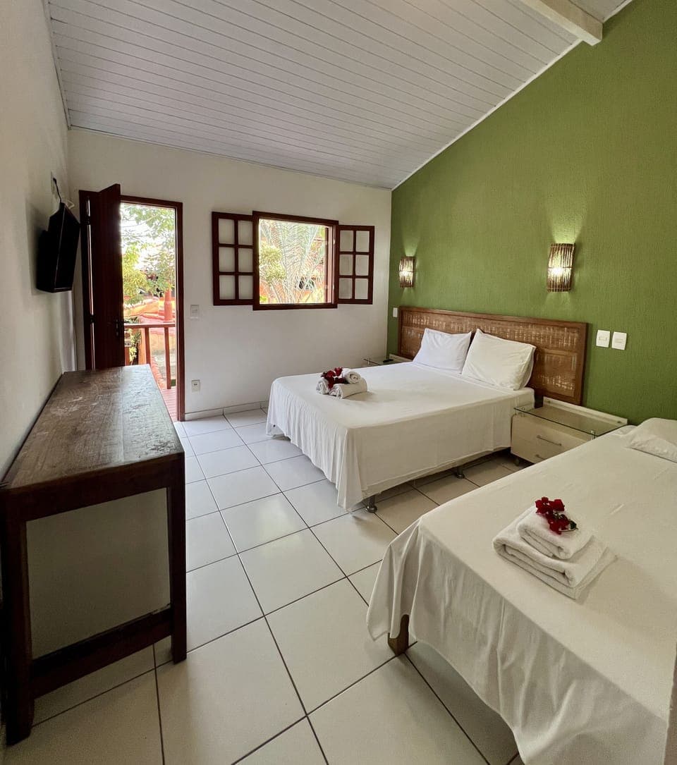 Superior Triple Room | Minibar, in-room safe, desk, iron/ironing board