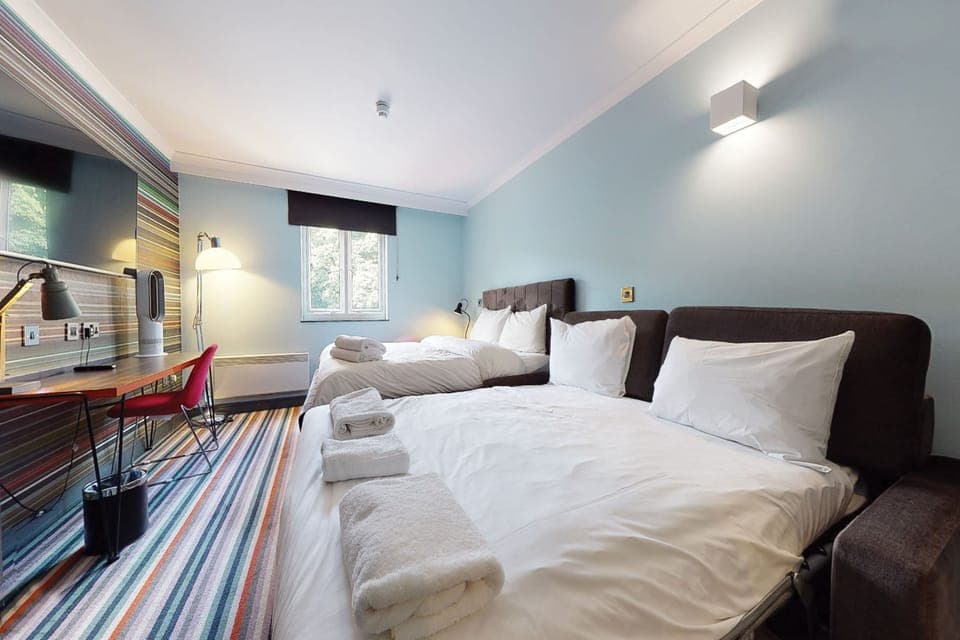 Family Room (1 Double & 2 Rollaway Beds) | Desk, laptop workspace, blackout drapes, iron/ironing board