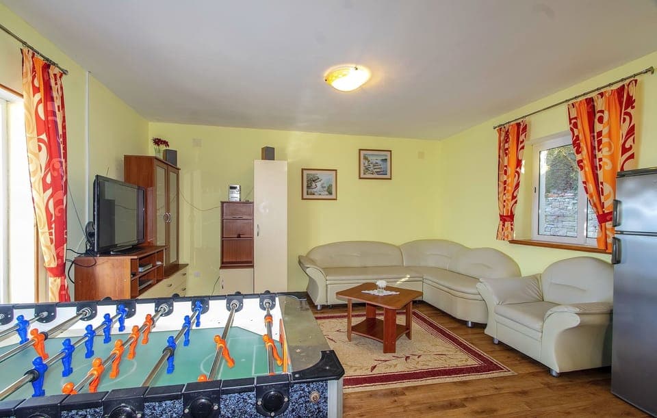 House (Four Bedroom House with Pool) | Living room | TV, foosball