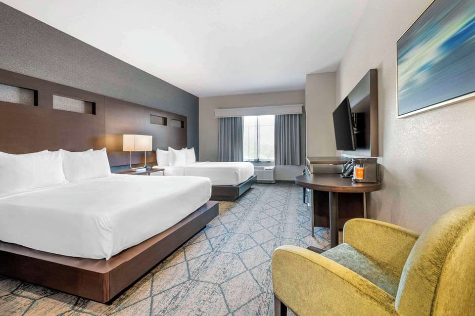 Premium bedding, desk, laptop workspace, iron/ironing board