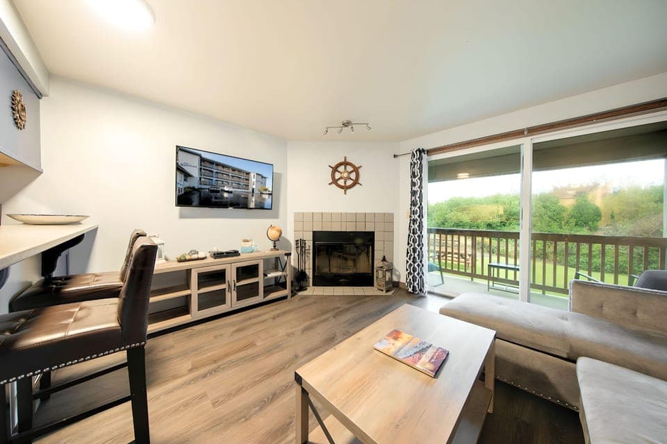 Condo | Living room | 50-inch flat-screen TV with cable channels, Smart TV, fireplace
