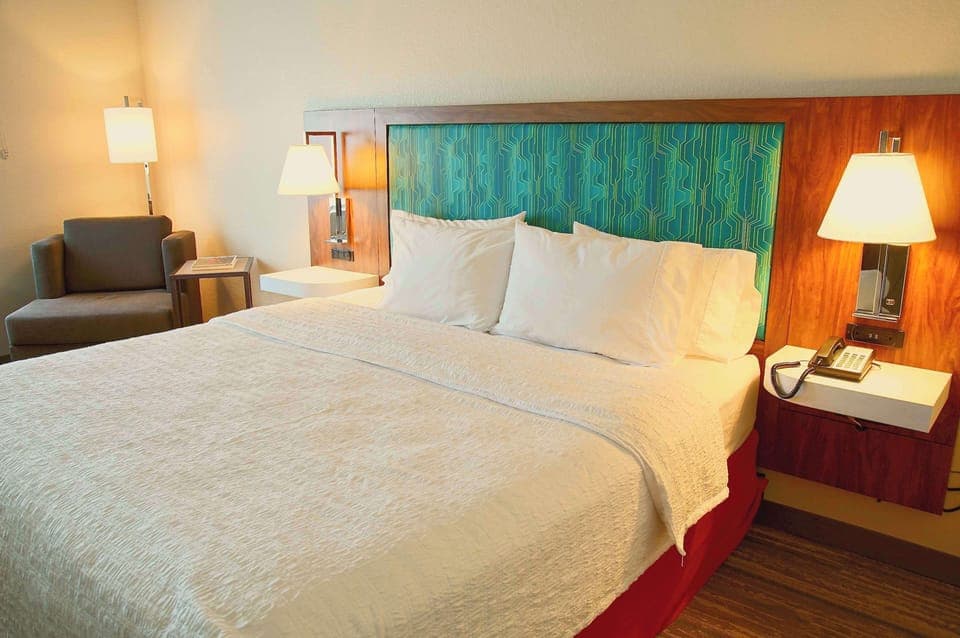 Premium bedding, desk, laptop workspace, iron/ironing board