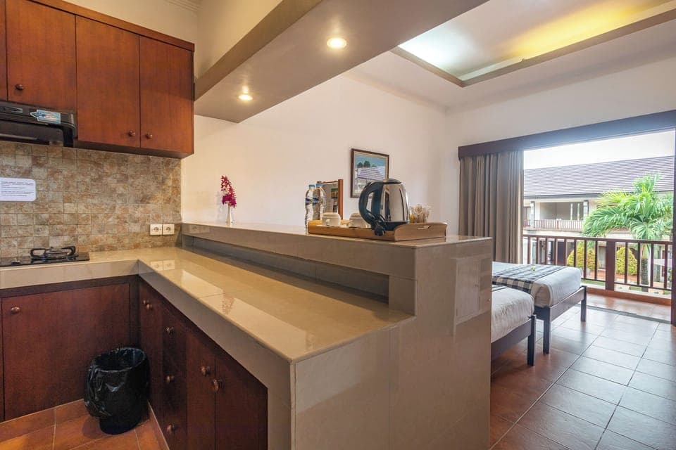 Family Room, Kitchenette | Private kitchen | Fridge, electric kettle