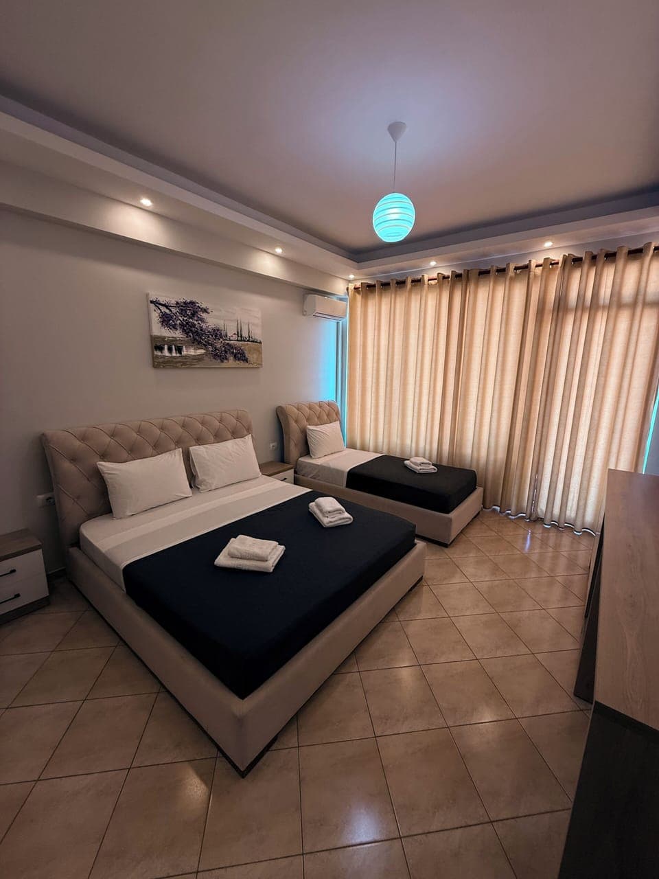 Deluxe Triple Room | Blackout drapes, iron/ironing board, free cribs/infant beds, free WiFi