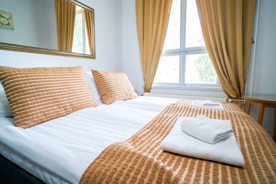Panoramic Double or Twin Room | Desk, laptop workspace, blackout drapes, iron/ironing board