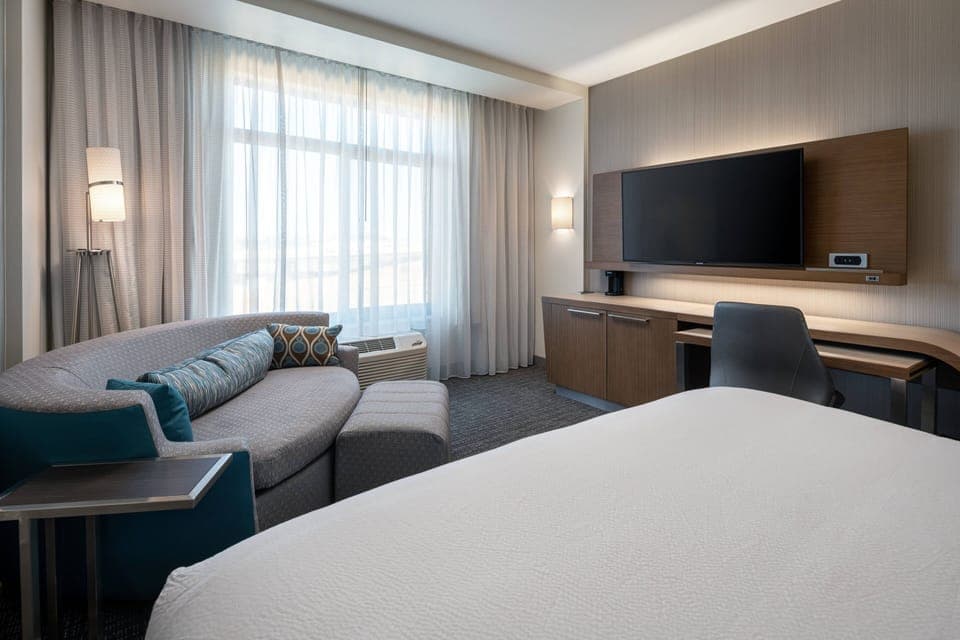 Desk, laptop workspace, iron/ironing board, free cribs/infant beds