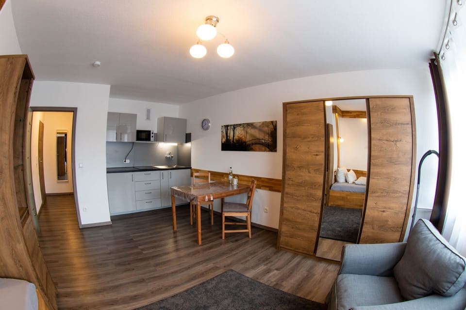 Comfort Studio | Living area | Flat-screen TV