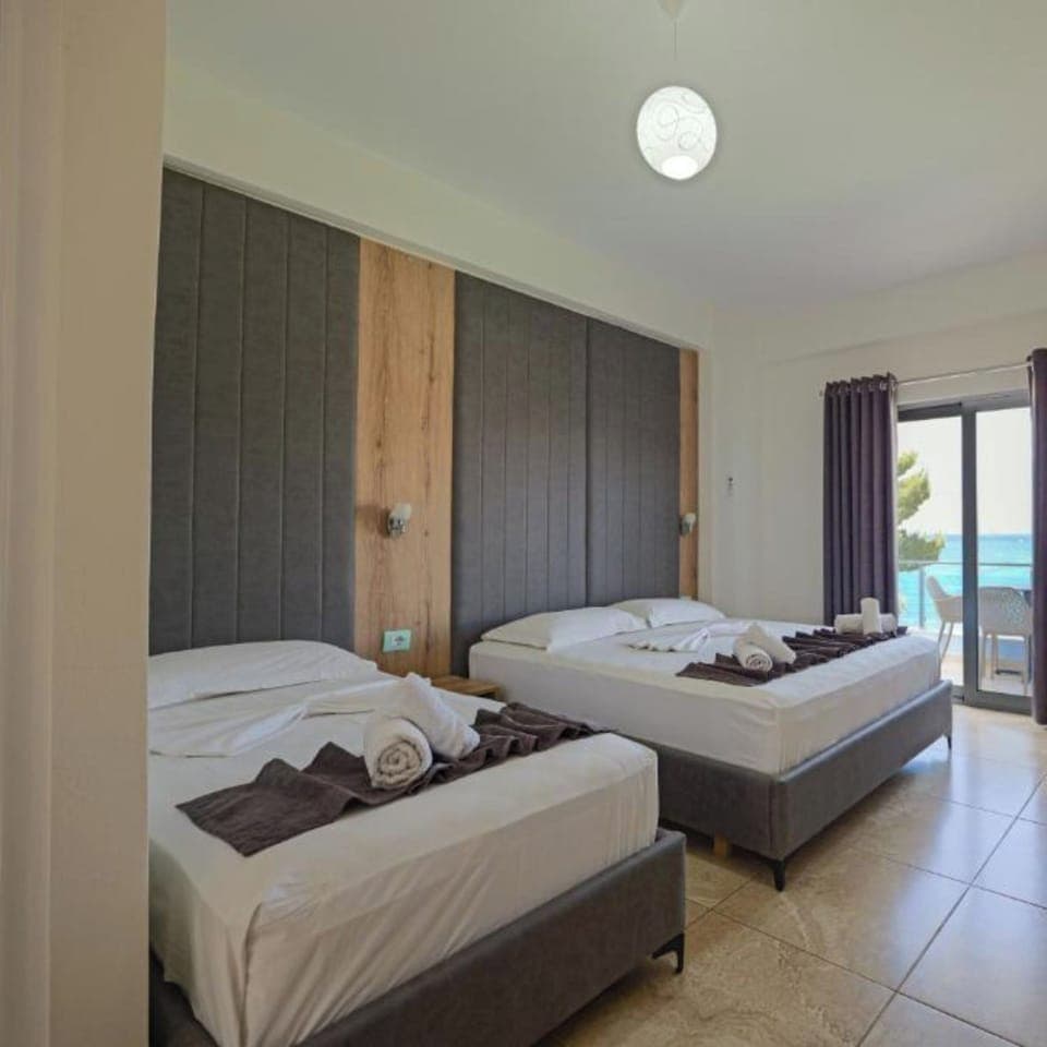 Triple Room, Sea View | Desk, iron/ironing board, free WiFi, bed sheets