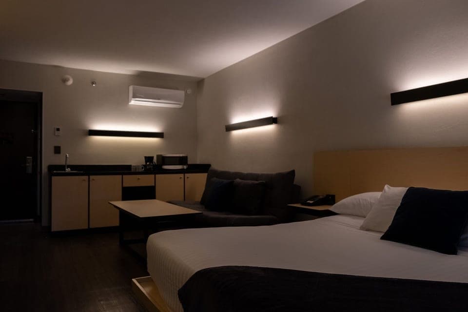 Deluxe Studio Suite | In-room safe, desk, laptop workspace, iron/ironing board