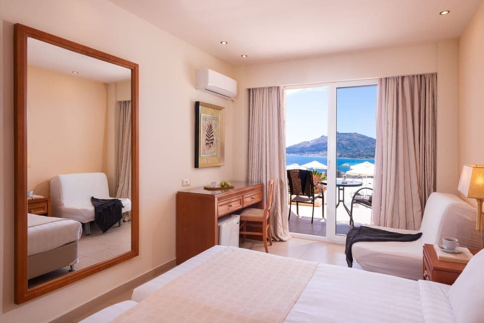 Poolfront Double Room with Sea View | Pillowtop beds, in-room safe, desk, blackout drapes