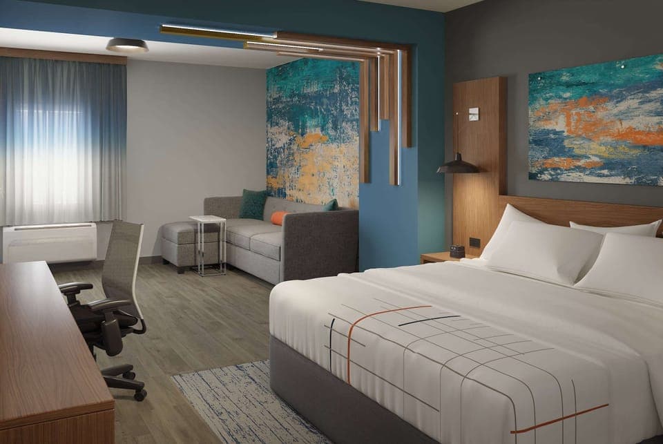 Desk, laptop workspace, blackout drapes, iron/ironing board