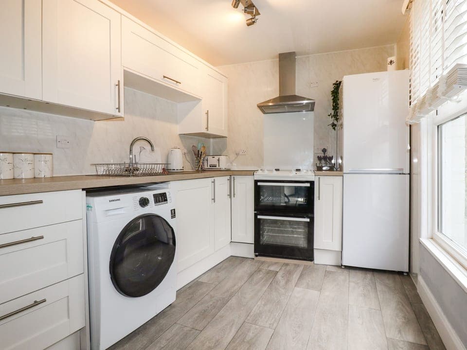 Fridge, electric kettle, toaster, cookware/dishes/utensils