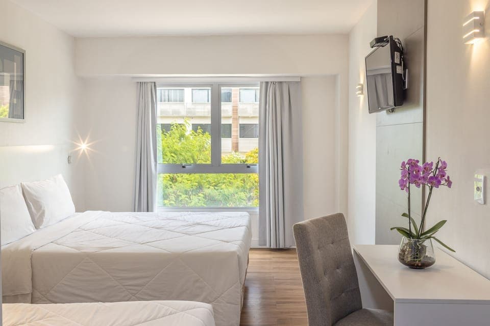 Standard Triple Room | Minibar, in-room safe, desk, laptop workspace