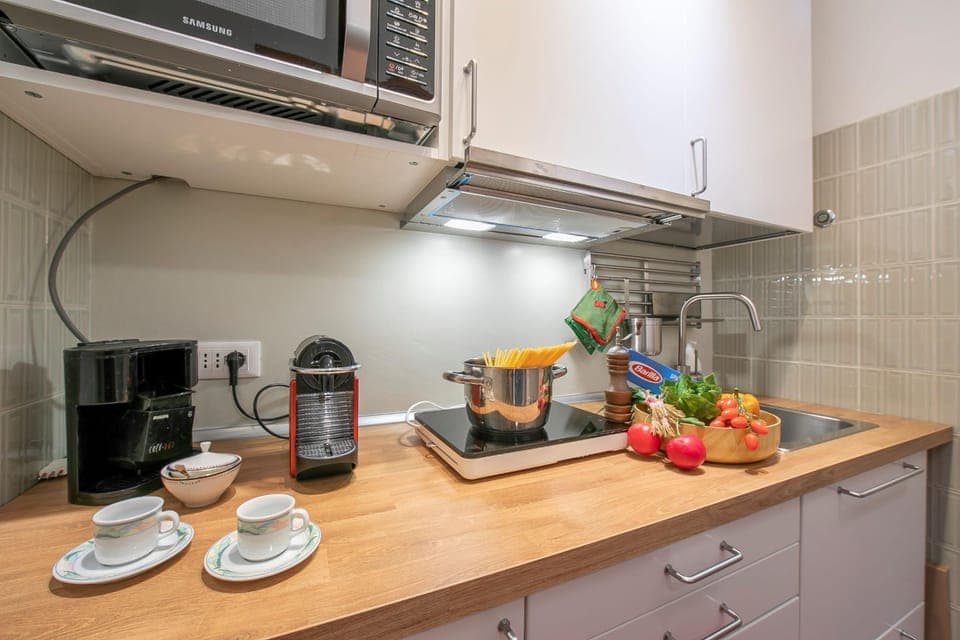 Family Apartment, Multiple Bedrooms (Il Nido Nella Pineta) | Private kitchenette | Fridge, microwave, stovetop, coffee/tea maker