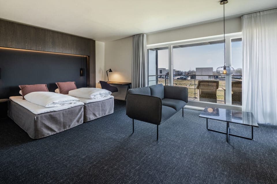 Junior Suite, Patio | Premium bedding, desk, blackout drapes, iron/ironing board