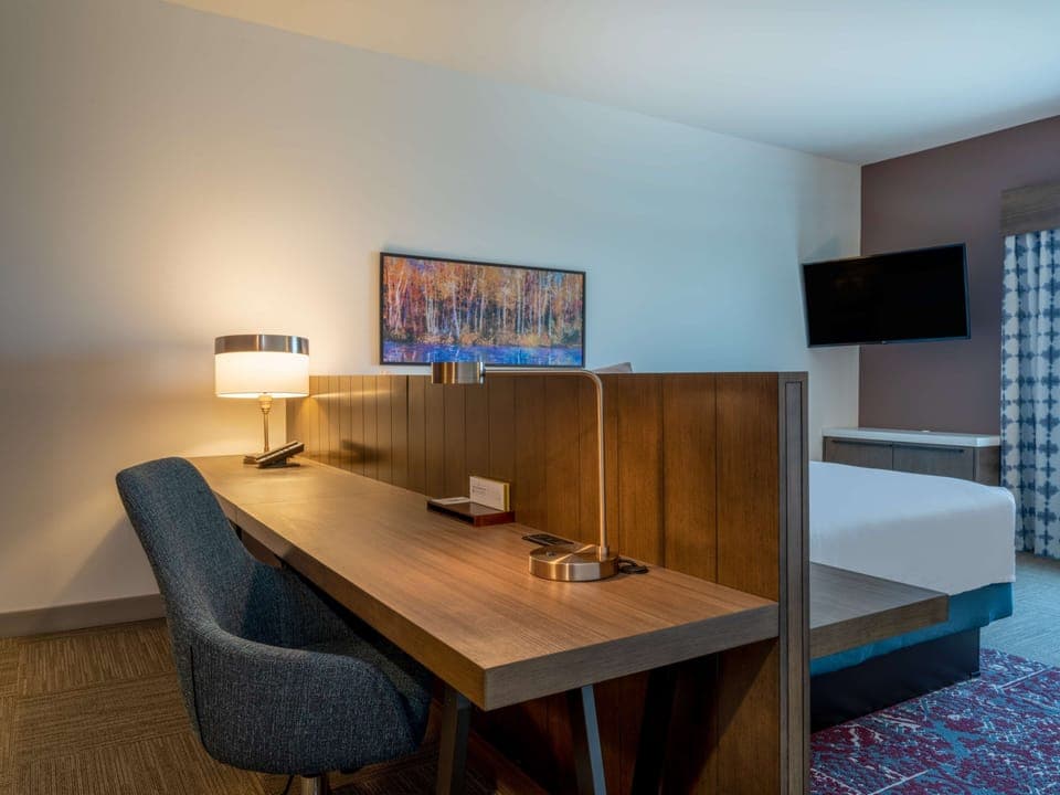 Desk, laptop workspace, blackout drapes, iron/ironing board