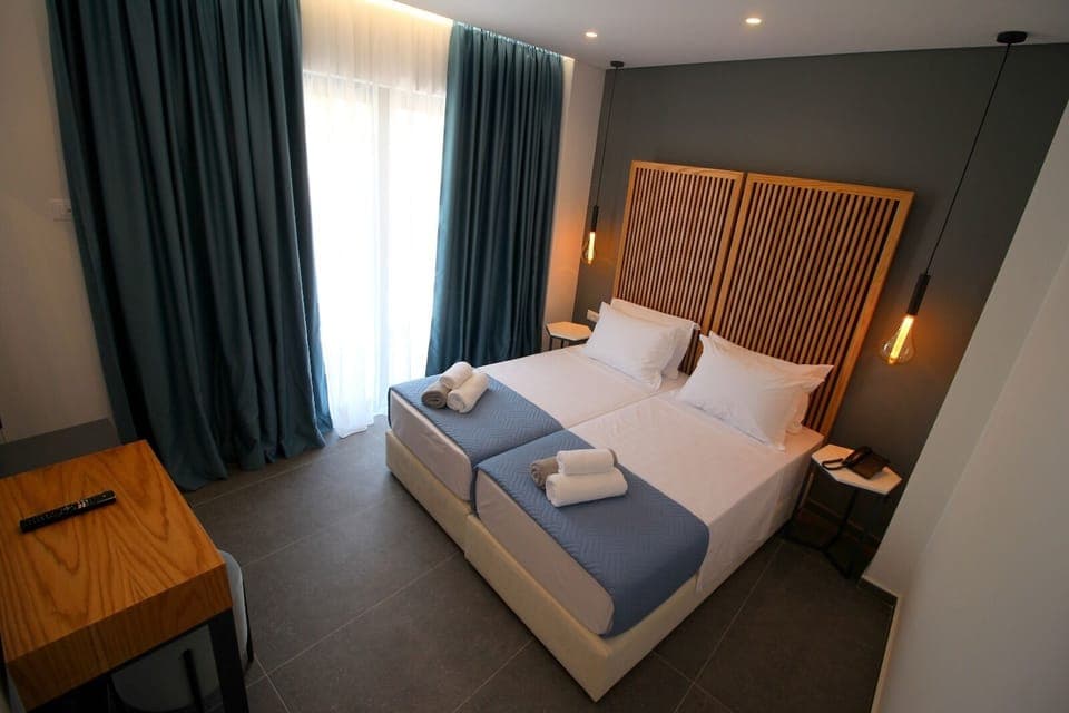 Double or Twin Room, Ground Floor | Minibar, in-room safe, desk, blackout drapes