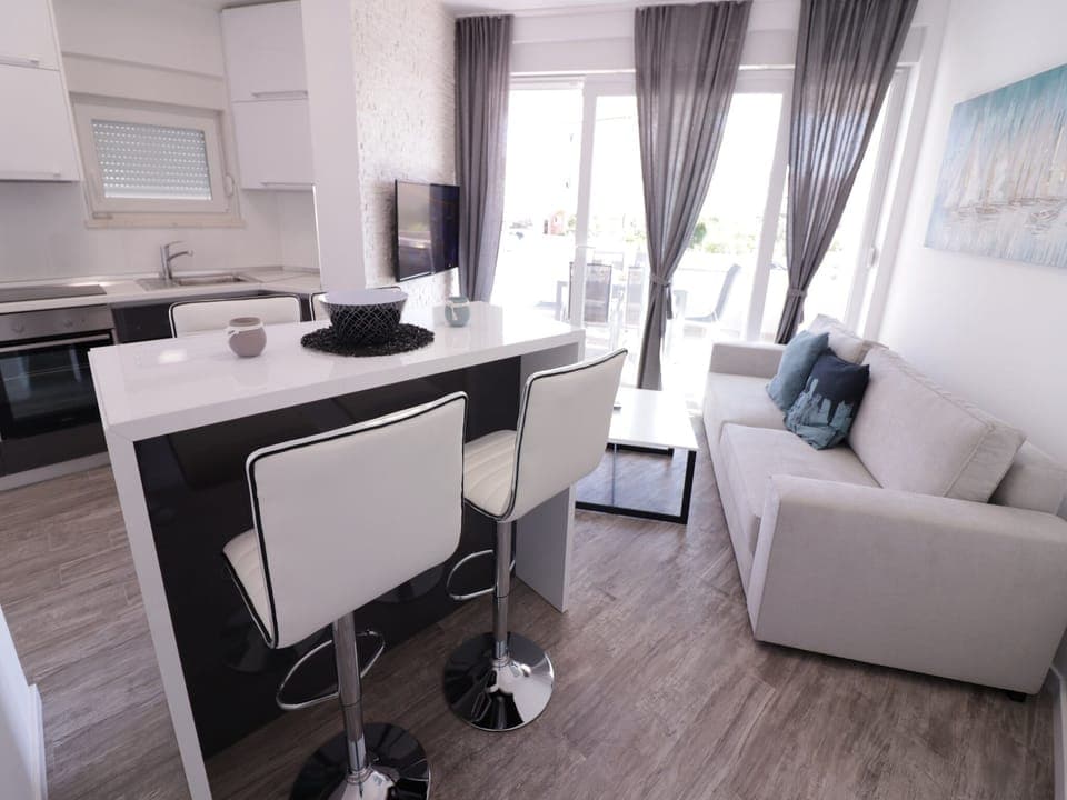 Deluxe Apartment, 1 Bedroom, Non Smoking, Pool Access | Living area | 45-inch flat-screen TV with satellite channels, TV