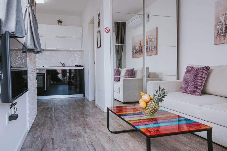 Deluxe Studio, Non Smoking, Pool Access | Living area | 45-inch flat-screen TV with satellite channels, TV