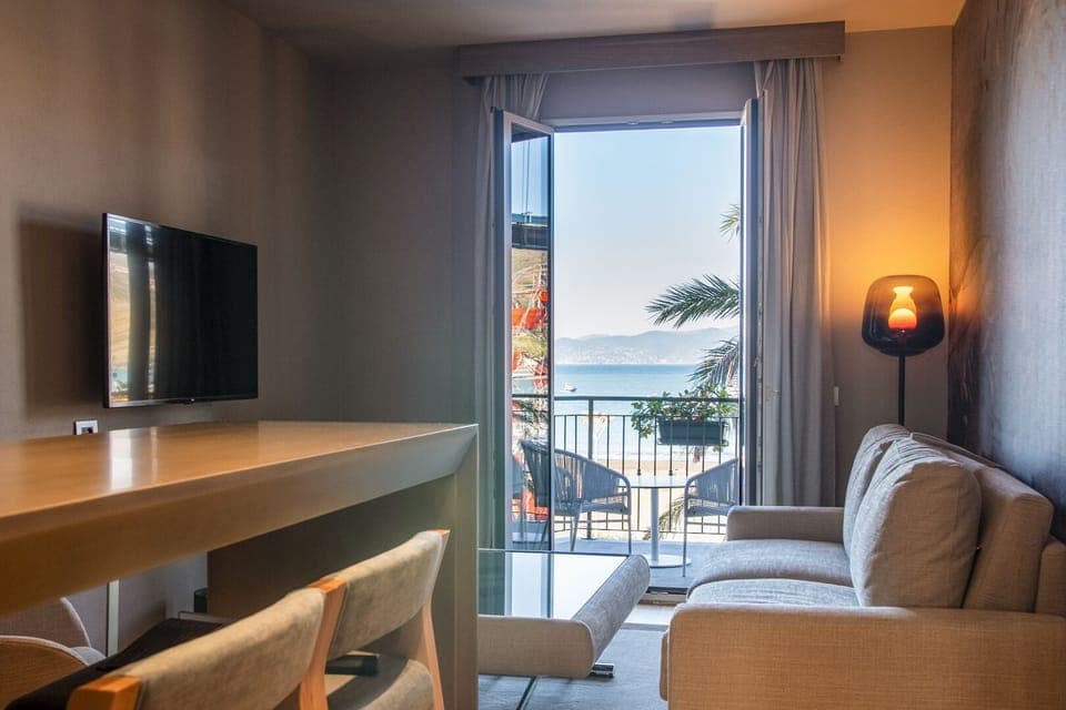 One bedroom apartment, balcony, sea view of the Baia delle Favole | Living area | 50-inch Smart TV with digital channels, TV