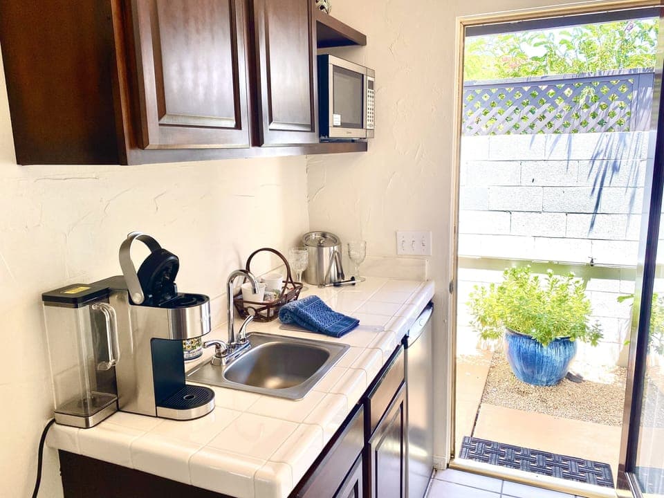 Suite, 1 King Bed, Pool View | Private kitchenette | Fridge, microwave, coffee/tea maker, toaster