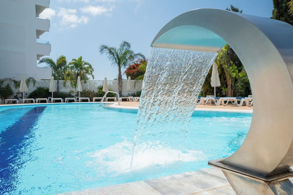 Indoor pool, seasonal outdoor pool, pool umbrellas, sun loungers