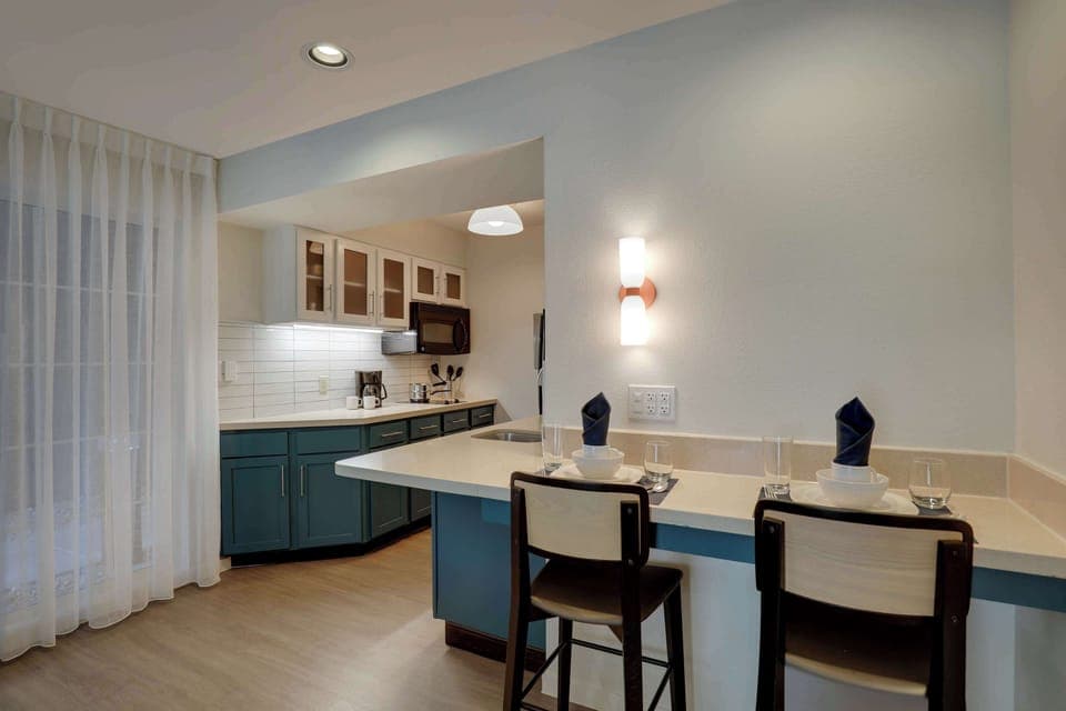 Suite, 1 Queen Bed with Sofa bed (One Bedroom) | Private kitchenette | Full-size fridge, microwave, stovetop, dishwasher