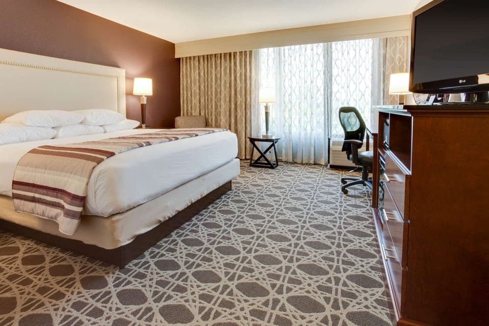 Desk, laptop workspace, blackout drapes, iron/ironing board