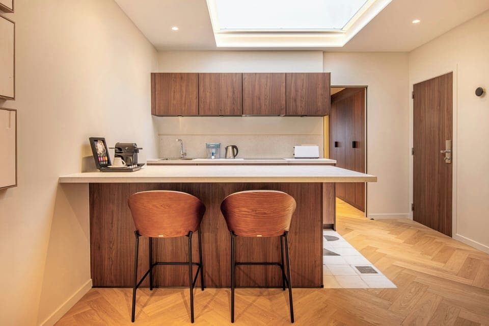 Premium bedding, desk, laptop workspace, blackout drapes