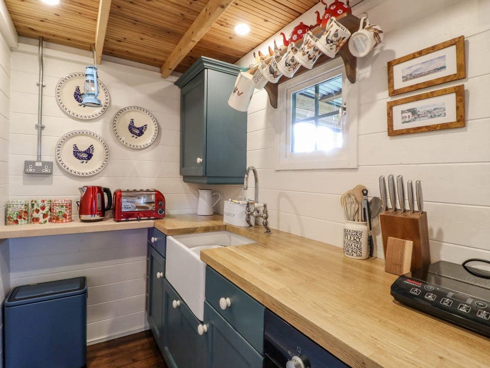 Fridge, electric kettle, toaster, cookware/dishes/utensils