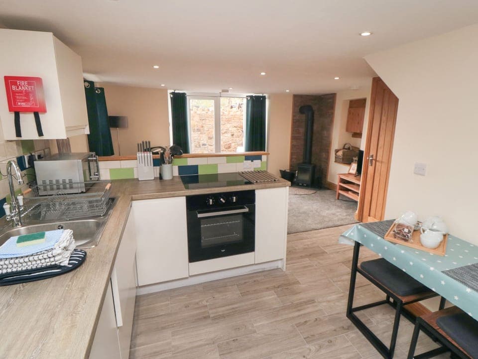 Fridge, electric kettle, toaster, cookware/dishes/utensils