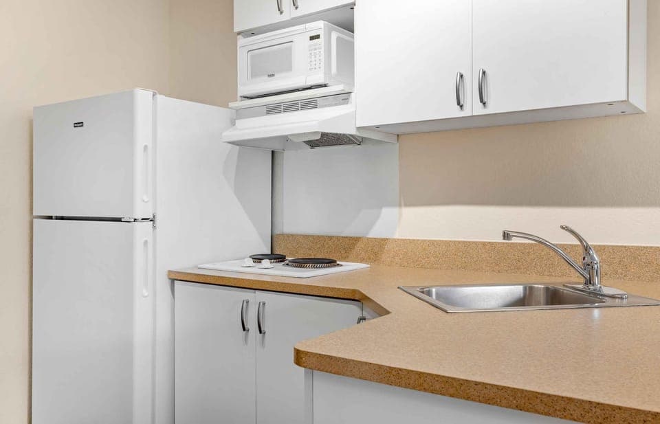 Studio, 1 Queen Bed, Non Smoking | Private kitchen | Full-size fridge, microwave, stovetop, coffee/tea maker