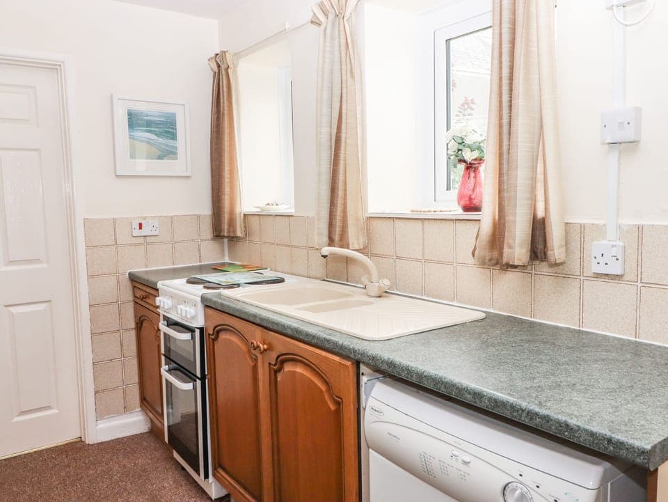 Fridge, electric kettle, cookware/dishes/utensils