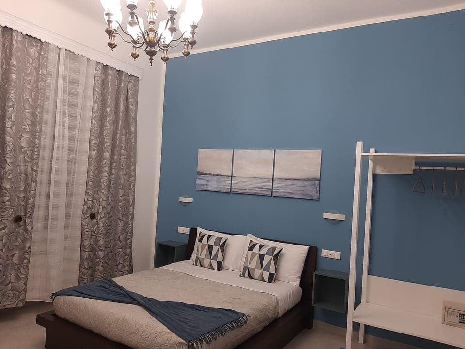 Family Quadruple Room, Non Smoking | Down comforters, in-room safe, desk, laptop workspace