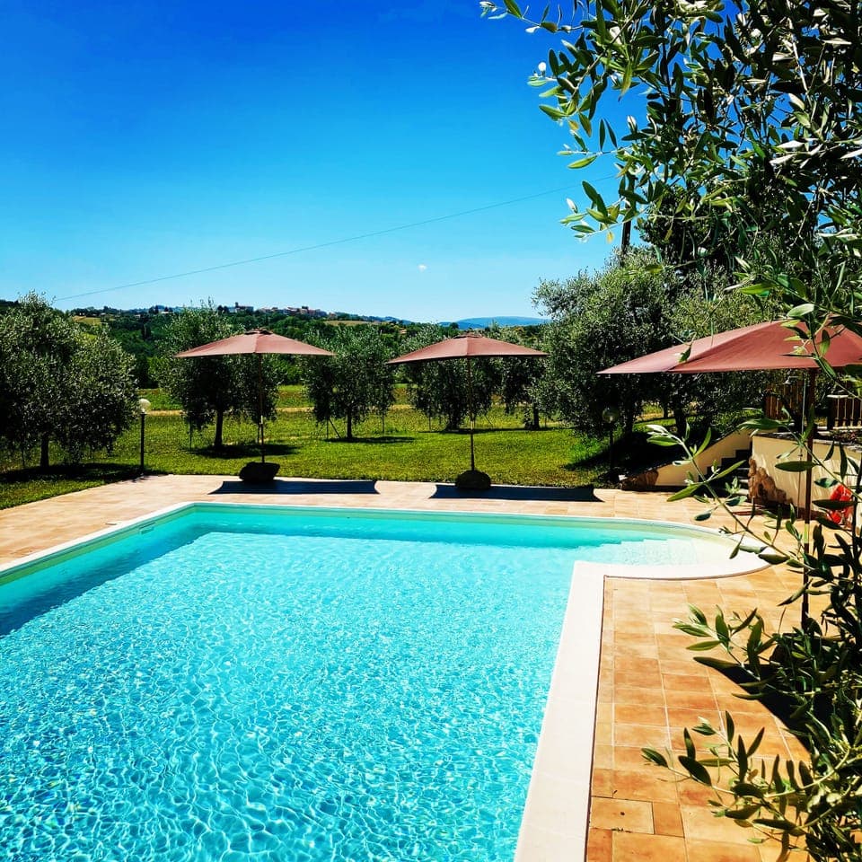 Seasonal outdoor pool, open 7:00 AM to 7:00 PM, pool umbrellas