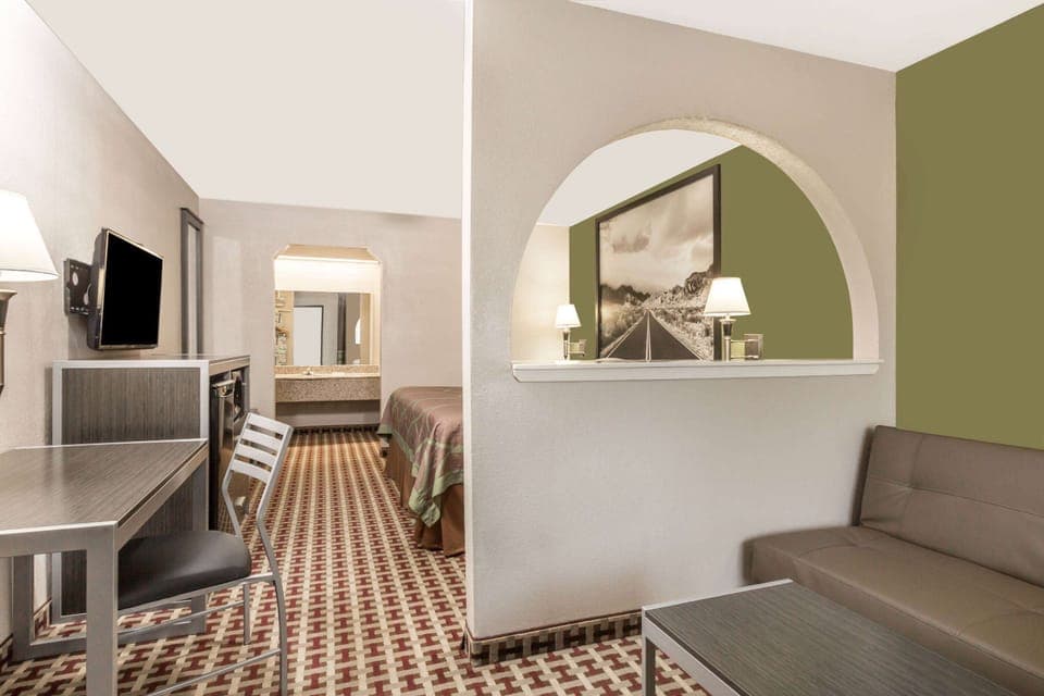 Suite, 1 King Bed, Smoking (Mini-Suite, First Floor) | Premium bedding, down comforters, pillowtop beds, desk