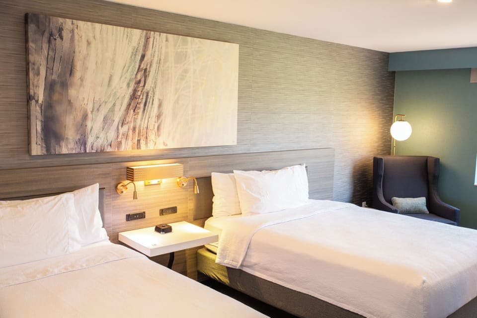 Room, 2 Queen Beds, Non Smoking | Hypo-allergenic bedding, down comforters, in-room safe, blackout drapes