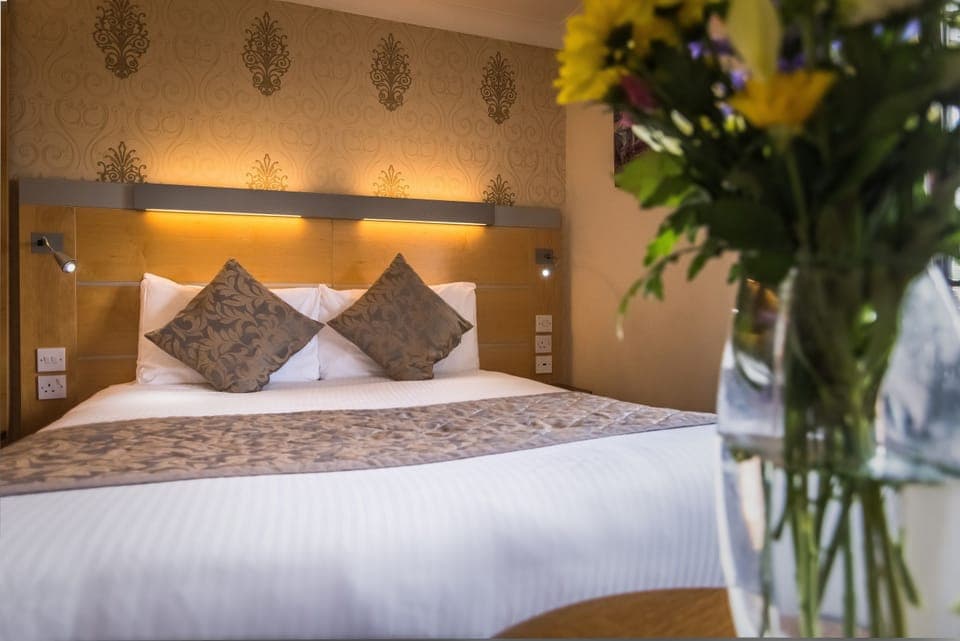 Desk, laptop workspace, blackout drapes, iron/ironing board