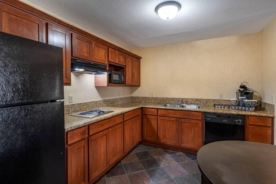 Desk, laptop workspace, blackout drapes, iron/ironing board