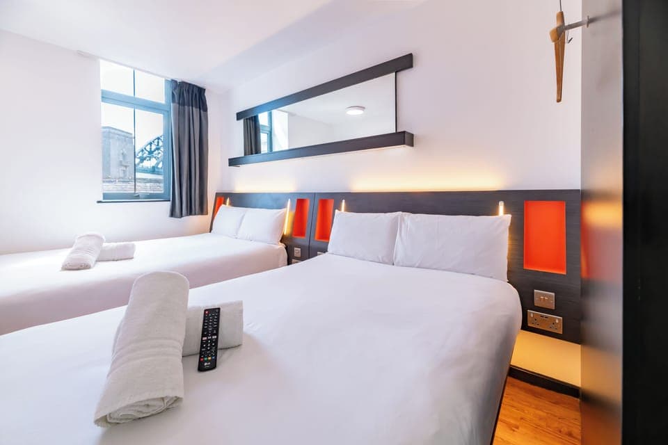 Family Quad Room with window | Premium bedding, in-room safe, soundproofing, iron/ironing board