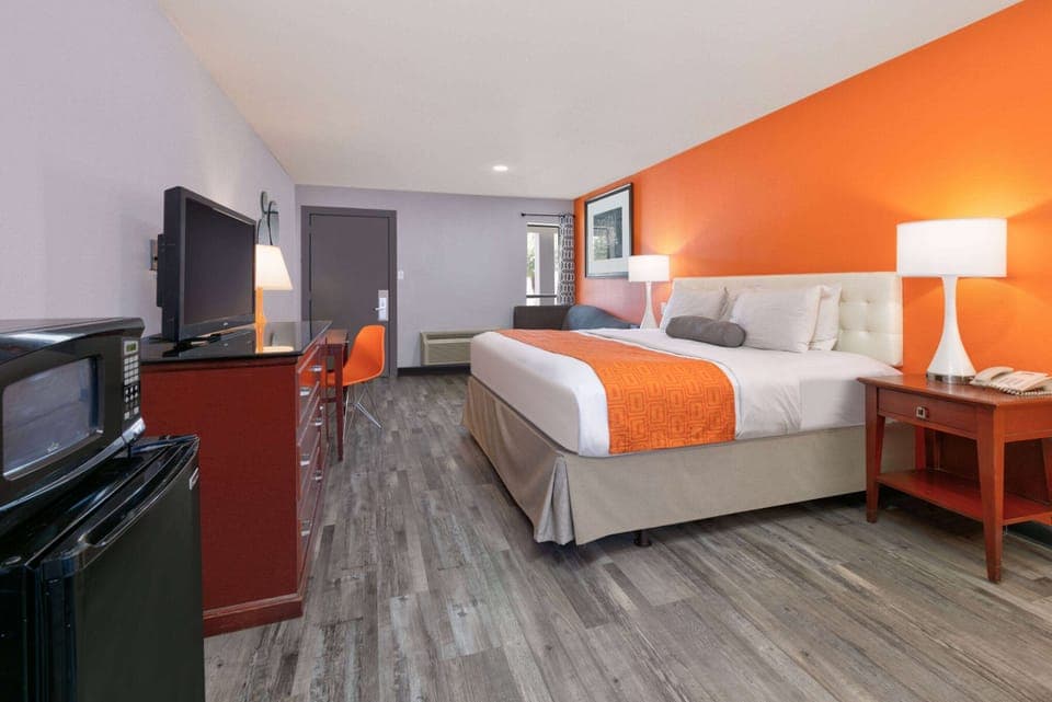 Desk, laptop workspace, blackout drapes, iron/ironing board