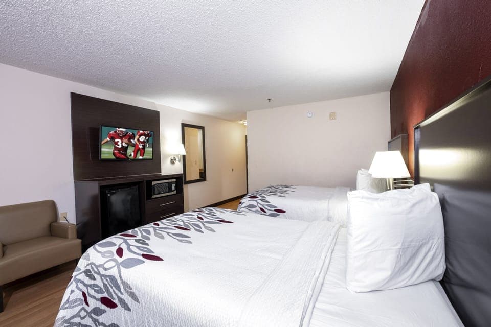 Desk, laptop workspace, blackout drapes, iron/ironing board