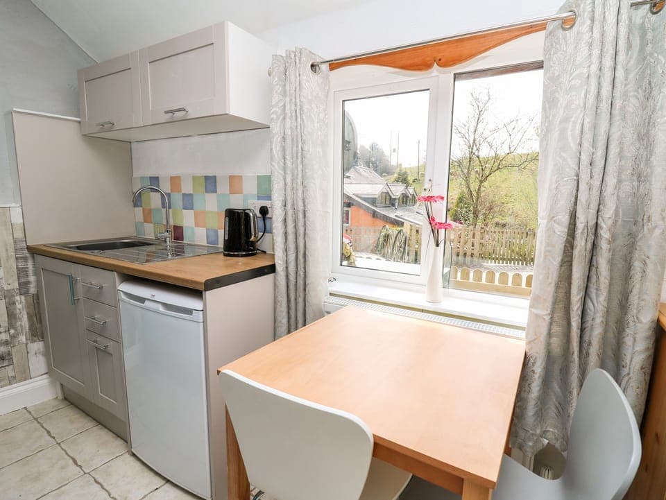 Fridge, electric kettle, toaster, cookware/dishes/utensils