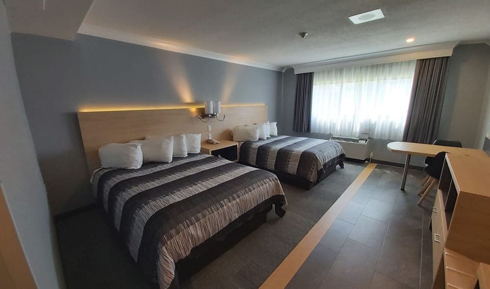 Desk, blackout drapes, iron/ironing board, free cribs/infant beds