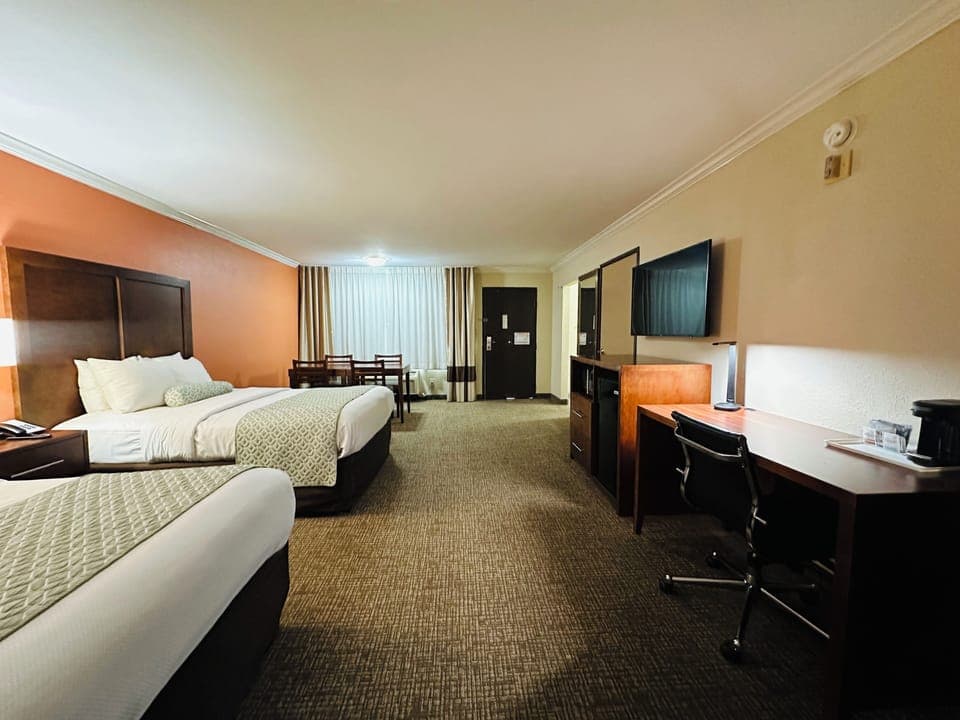 Family Room, 2 Queen Beds, Roll-in Shower | Pillowtop beds, in-room safe, desk, blackout drapes