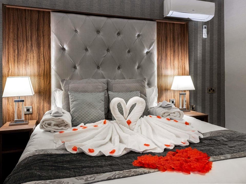 Desk, laptop workspace, blackout drapes, iron/ironing board